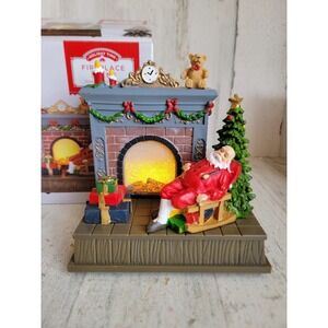 Holiday time Santa Claus fireplace scene flickering light up Xmas figure
